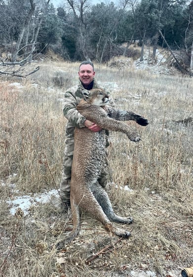 Adam Naslund with mountain lion
